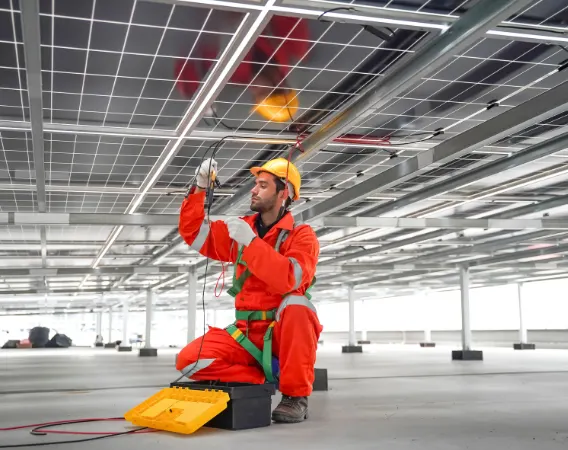 Ares Energy technician inspecting solar system wiring to identify underlying safety concerns and performance faults in a residential installation, Perth, WA