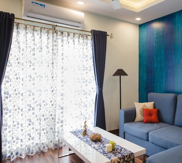 Technician conducting a site assessment to select the correct air conditioning unit size and location for a residential home – Ares Energy & Electricals