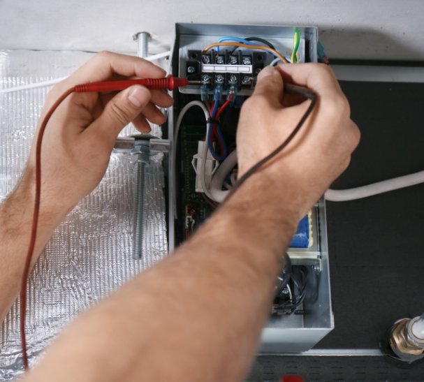 Electrician installing a dedicated circuit and verifying switchboard capacity before air conditioner installation – Ares Energy & Electricals