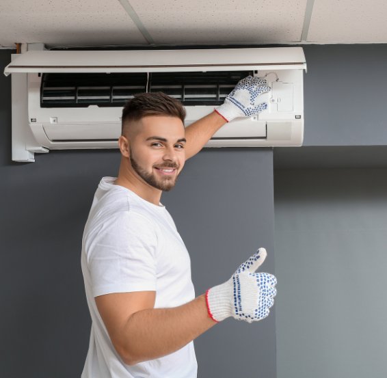 Licensed electrician installing a split-system air conditioner including indoor and outdoor unit mounting and electrical connection – Ares Energy & Electricals, Perth WA