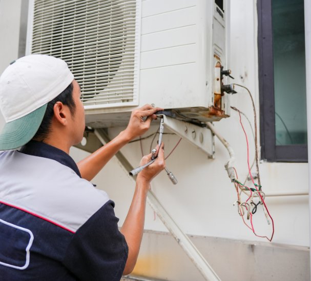 Licensed technician mounting indoor and outdoor AC units, running refrigerant lines, and completing electrical connections – Ares Energy & Electricals
