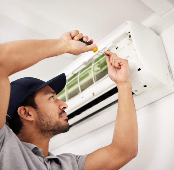 Licensed technician diagnosing and repairing an air conditioning system fault using electrical test equipment – Ares Energy & Electricals, Perth WA