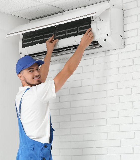 Licensed electrician completing a split-system air conditioner installation including electrical connection and commissioning – Ares Energy & Electricals