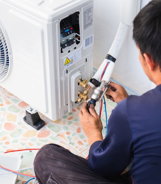Technician servicing and repairing an air conditioning unit by testing electrical components and refrigerant connections – Ares Energy & Electricals