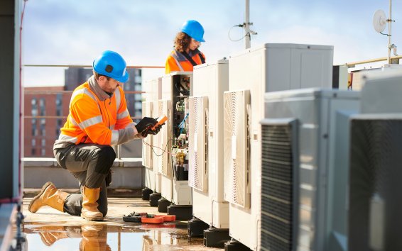 Licensed electrician inspecting air conditioning electrical connections for safety and compliance with Australian standards – Ares Energy & Electricals